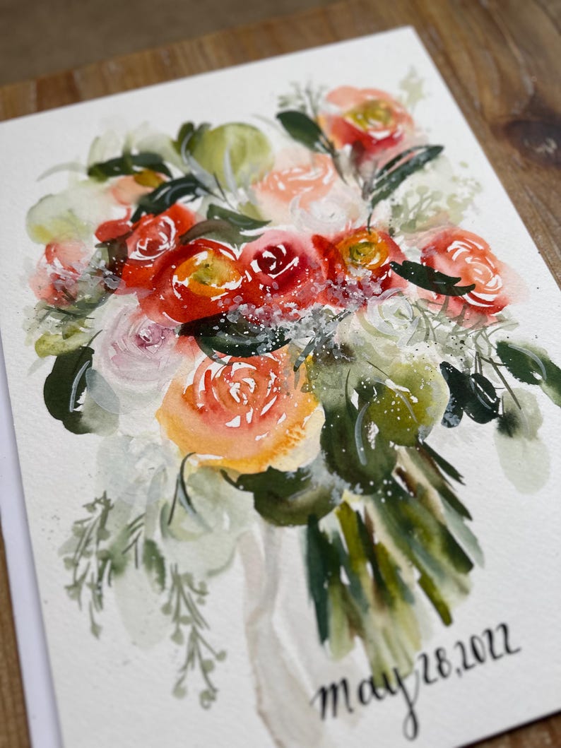 May include: A watercolor painting of a floral bouquet featuring red, orange, pink, and white flowers with green foliage. The artwork includes white paint splatters and the handwritten text "may 28, 2022" in black ink at the bottom right corner.