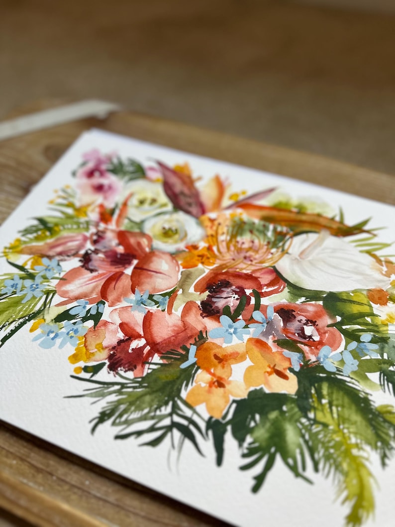 May include: A watercolor painting on white paper featuring a vibrant floral arrangement. The composition includes large coral and orange blossoms, delicate light blue flowers, white petals, and various green foliage, all rendered with fluid brushstrokes.