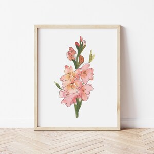 May include: A framed watercolor painting of a pink flower with green stems and leaves. The flower is in bloom and has a delicate, feminine feel.