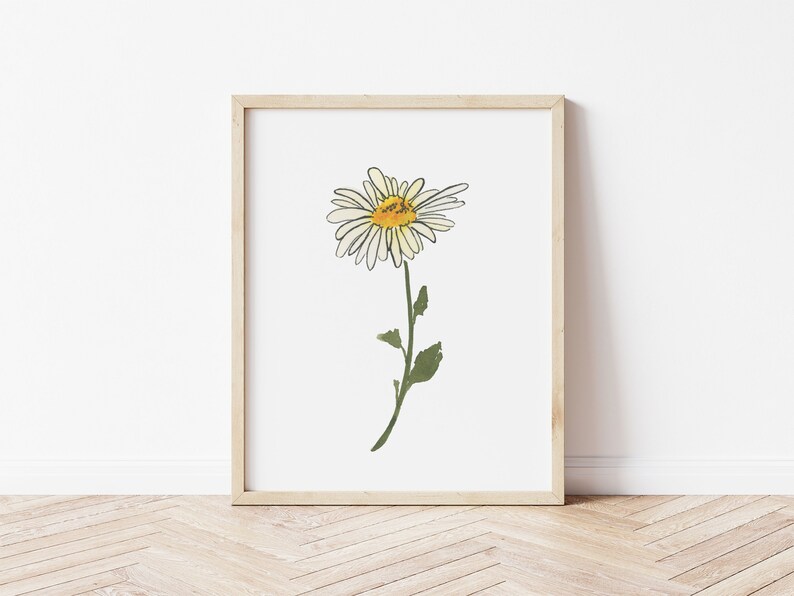 Pu&ograve; includere: Una stampa incorniciata di un singolo margherita bianca con un centro giallo e uno stelo verde. La margherita &egrave; disegnata in uno stile semplice e minimalista.