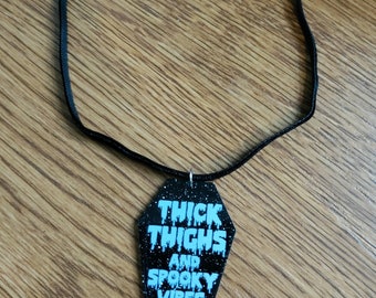 Thick Thighs and Spooky Vibes Coffin Choker: Glittery Plastic Charm, Velvety Black Necklace