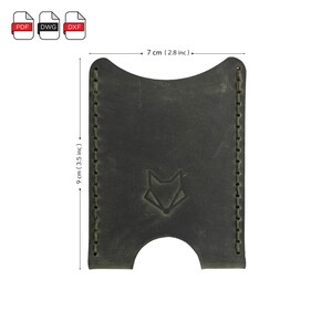 May include: A dark green leather card holder with a fox logo and stitched edges. The card holder measures 7 inches wide and 9 inches tall.