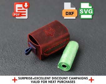May include: A red leather dog poop bag dispenser with a blue strap and a green plastic bag dispenser. The bag dispenser has a fox logo on the front.
