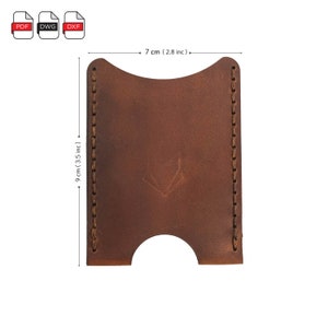 May include: A brown leather card holder with a stitched edge and a small logo in the center. The card holder measures 7 inches wide and 9 inches tall.