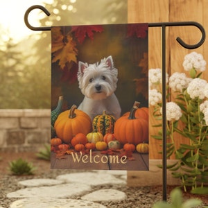 May include: A white West Highland Terrier dog sits in front of a pile of pumpkins and fall leaves. The dog is looking at the camera. The pumpkins are various sizes and colors, including orange, green, and white. The text "Welcome" is printed on the bottom of the image.