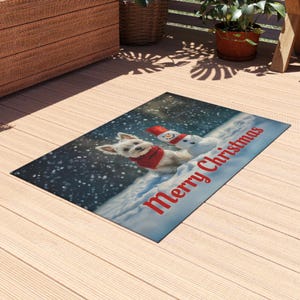 May include: Rectangular Christmas rug depicting a white dog and snowman in a snowy landscape. The dog is wearing a red scarf, and the snowman has a red hat. The words "Merry Christmas" are written in red across the bottom.