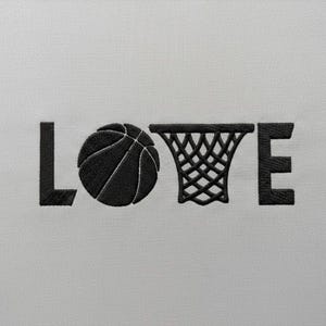 May include: Black embroidered design on a white background. The word "LOVE" is spelled out with a basketball replacing the "O" and a basketball net replacing the "V". The basketball has visible seams.