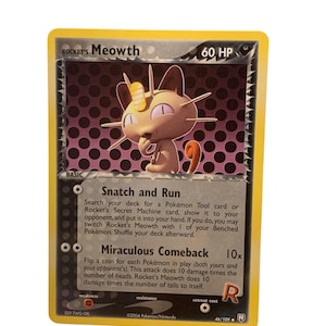May include: A Pokémon trading card featuring Rocket's Meowth with 60 HP. The card has a yellow border and a purple and black background. The card text includes "Snatch and Run" and "Miraculous Comeback". The card is marked 46/109.