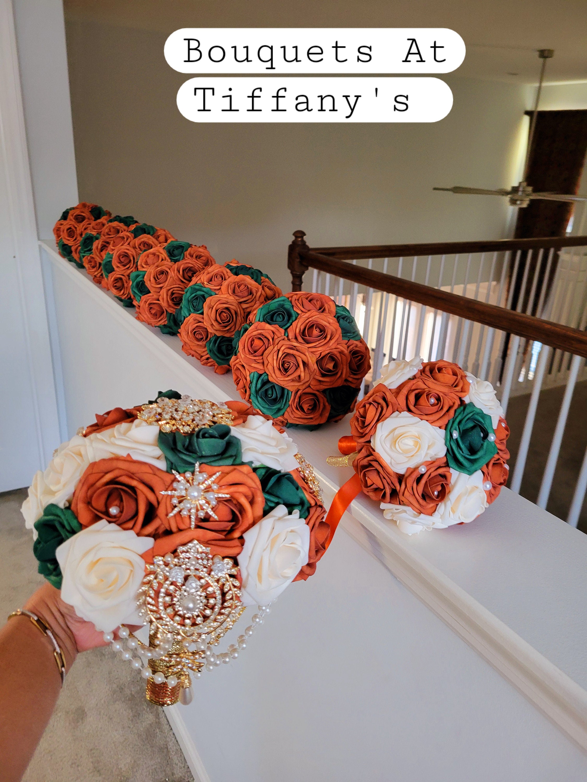 Real touch rose burnt orange/hunter green bouquets and boutonnieres