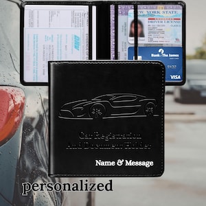 May include: Black leather car registration and document holder with a debossed sports car design. The holder is open, revealing slots for documents, a driver's license, and a credit card. The text "Car Registration And Document Holder" and "Name & Message" are visible.