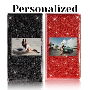 May include: Two glitter-covered personalized phone cases. One is black, the other red. Each case has a photo insert. The black case has a woman posing on a tire. The red case has a woman leaning on a green car. The word "Personalized" is at the top.