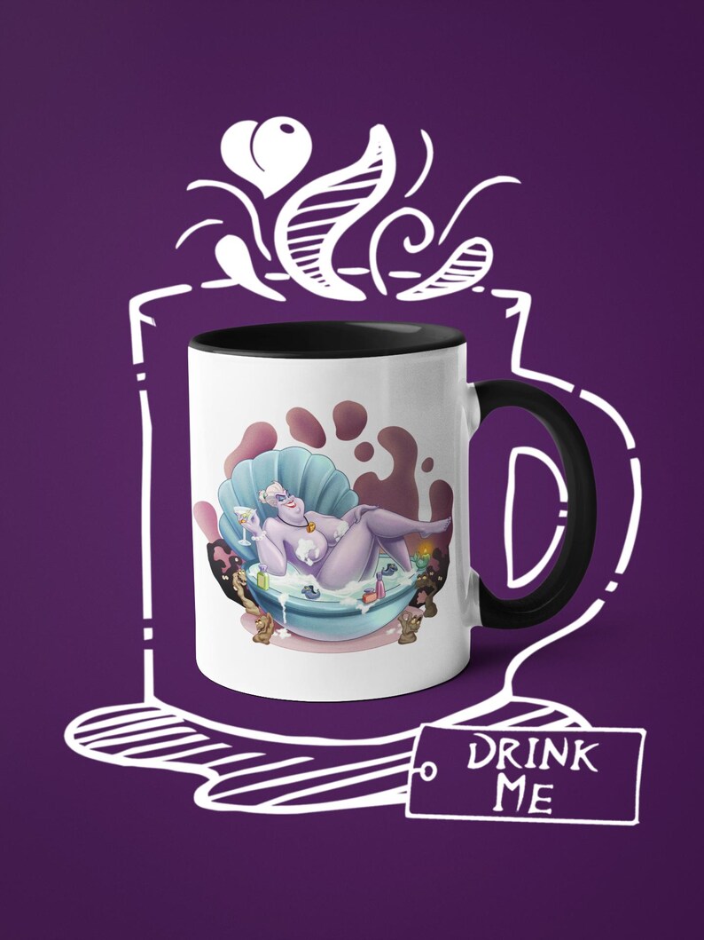 May include: White ceramic mug with a black interior and handle. The mug features a cartoon illustration of a purple character in a seashell bathtub. The words "DRINK ME" are on a tag attached to the mug. The background is purple.