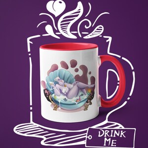May include: White ceramic mug with a red interior and handle. The mug features a cartoon illustration of a purple character in a seashell bathtub. The mug has the text "DRINK ME" on a tag. The background is purple.