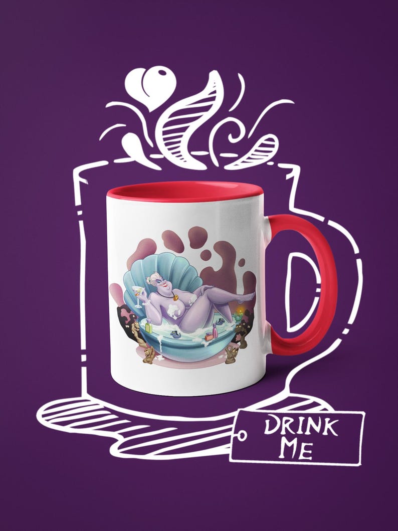 May include: White ceramic mug with a red interior and handle. The mug features a cartoon illustration of a purple character in a seashell bathtub. The mug has the text "DRINK ME" on a tag. The background is purple.