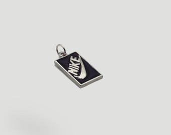 silver nike logo