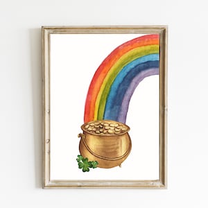 Può includere: Un dipinto ad acquerello di un arcobaleno con un pentolone d'oro alla fine. Il pentolone è d'oro con un trifoglio verde.