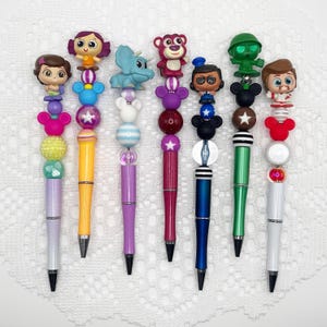 Toy Story inspired autograph pen, beaded ballpoint pen with Disney Doorable Forky, Lotso, Duke Caboom, Trixie, Dolly, Toy Soldier, Giggle
