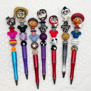 Coco Inspired Autograph Pen, beaded ballpoint pen with Disney Pixar Doorable, Miguel, Hector, Imelda, Dante, Ernesto