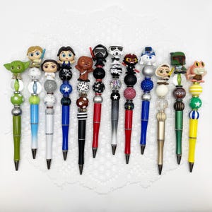 Star Wars Inspired Autograph Pen, beaded ballpoint pen with Disney Doorable, Yoda, Mandelorian, Storm Trooper, Chewbacca, Luke Skywalker