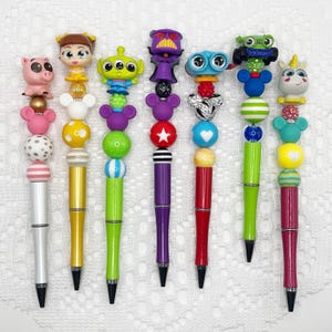 Toy Story inspired autograph pen, beaded ballpoint pen with Disney Doorable, Zurg, Lenny, Buzz Lightyear, Alien, Hamm, Buttercup, Gabby