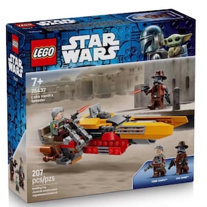 May include: A white ceramic mug with a black handle and the text "But First, Coffee" in a bold, black font. The mug is set against a blurred background, suggesting a cosy setting.