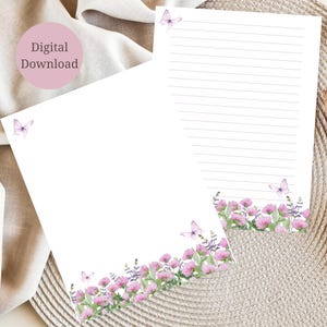 May include: Two sheets of white stationery with a floral and butterfly design. The bottom of each sheet features pink flowers and purple lavender. Light purple butterflies are scattered across the top and bottom. The text "Digital Download" is in a pink circle.