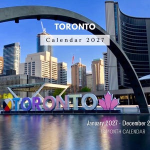 May include: A 12-month calendar for 2027 featuring a photograph of the Toronto city skyline, the Toronto sign, and a reflecting pool. The text reads TORONTO Calendar 2027 and January 2027 - December 2027 12 MONTH CALENDAR against a clear blue sky.