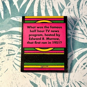 May include: A pink and black trivia card with the question "What was the famous half hour TV news program, hosted by Edward R. Murrow, that first ran in 1951?"