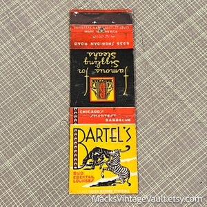 May include: Vintage matchbook featuring the text "Famous for Sizzling Steaks" and "Bartel's". The matchbook has a black, red, and yellow color scheme with illustrations of a zebra and a dog. The text "Bud Cocktail Lounge" is also visible.