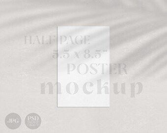May include: A white mockup of a half page poster, measuring 5.5 x 8.5 inches. The poster is laying flat on a white textured surface with shadows from a plant.