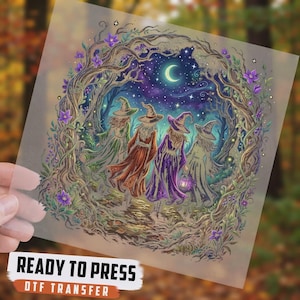 May include: A DTF transfer sheet featuring a colorful illustration of four figures in pointed hats walking through a forest archway under a crescent moon and starry night sky. The design includes purple flowers, twisted tree branches, and text.