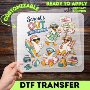 May include: A clear DTF transfer sheet featuring cartoon ducks celebrating summer with the text School's OUT FOR SUMMER, BYE HOMEWORK, HELLO SUMMER, and NO ALARMS. The design includes ducks with surfboards, ice cream, goggles, and beach chairs.