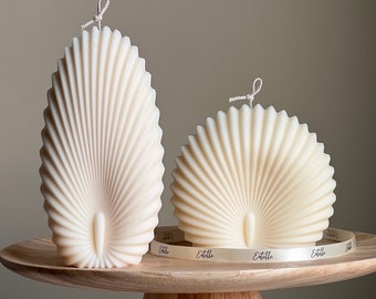 Dúo de velas con forma de concha marina: Velas decorativas de cera de soja con forma de concha marina.