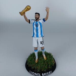 Lionel Messi figure ,  world cup trophy ,