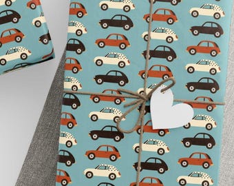 May include: Gift-wrapped presents with a repeating pattern of cartoon cars in black, white, and orange on a light blue background. The gifts are tied with twine and adorned with white paper tags.