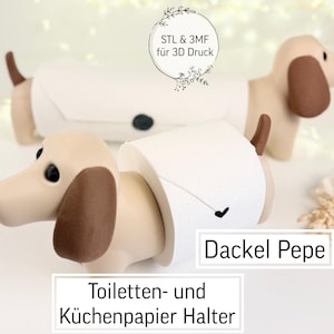 May include: A pair of dachshund-shaped toilet paper holders. The holders are tan with brown ears and tails, and hold white toilet paper rolls. The text "Dackel Pepe" and "Toilet Paper Holder" are visible.