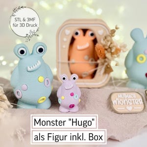 以下が含まれることがあります： パステルカラーの気まぐれなモンスターフィギュアのコレクション。大きな目を持つ水色のモンスター、小さな紫色のモンスター、箱に入ったモンスターが含まれています。「Monster Hugo」のテキストが表示されています。