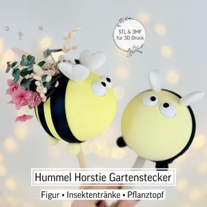 May include: Two yellow and black bee-shaped garden stakes. One bee holds a small bouquet of pink flowers and greenery. The stakes have white antennae and black accents. Text on the image reads "Hummel Horstie Gartenstecker" and "STL & 3MF für 3D Druck".