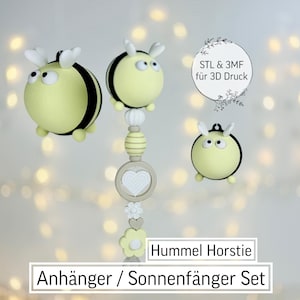 May include: A set of three yellow and black bee-shaped ornaments. One ornament is suspended from a decorative chain with a heart and flower. The text "Hummel Horstie Anhänger / Sonnenfänger Set" is displayed at the bottom of the image.