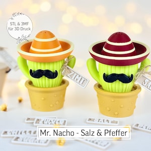Puede incluir: Dos saleros y pimenteros con forma de cactus con sombreros naranjas y rojos y bigotes negros. Los saleros están en macetas amarillas, con etiquetas que dicen "ZIMT" y "SALZ". El texto "Mr. Nacho - Salz & Pfeffer" está en la parte inferior.