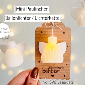 Puede incluir: Luces de globo en forma de ángel blanco, parte de una cadena de luces. La imagen incluye el texto "Mini Paulinchen" y "Ballonlichter / Lichterkette". Una etiqueta de madera muestra el texto "himmlisch behütet" y "inkl. SVG Laserdatei".