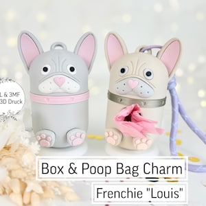 Op de afbeelding: Twee Franse Bulldog-vormige poepzakbedels in grijs en crème, met roze accenten op de oren en neus. Eén heeft een roze halsband, de andere een zilveren halsband. De tekst "Box & Poop Bag Charm Frenchie Louis" wordt hieronder weergegeven.