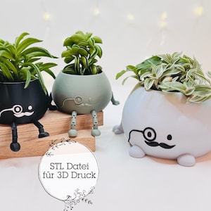 Puede incluir: Tres macetas impresas en 3D con caras y piernas lindas, cada una con un tipo diferente de planta. Las macetas son negras, verdes y grises. El texto "STL Datei für 3D Druck" es visible en la imagen.