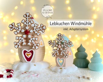 May include: A festive Christmas village scene featuring gingerbread house ornaments with snowflake toppers and heart-shaped accents. The houses sit on a snowy base, with candy canes and small Christmas trees. The text "Lebkuchen Windmühle" is visible.