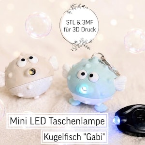 May include: Mini LED pufferfish-shaped flashlights, labeled "Gabi." One is light blue, the other beige. A black remote control flashlight is also present. The image includes text: "STL & 3MF für 3D Druck."