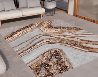May include: Rectangular area rug with a marbled design in shades of gray, beige, and brown. The rug features a flowing, abstract pattern resembling natural stone formations, adding a touch of elegance to the room.