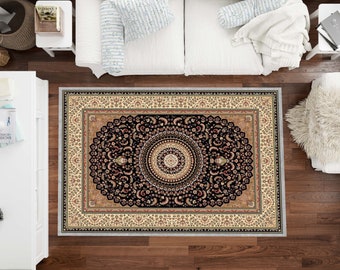 May include: A black and cream area rug with a large, intricate medallion design. The rug has a traditional, ornate pattern with floral motifs and a central circle.
