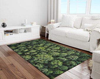 May include: A green and black area rug with a forest pattern. The rug is made of a soft, plush material and features a realistic aerial view of a forest.