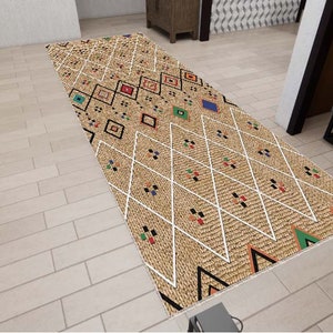 May include: A brown and white patterned rug with colorful geometric designs. The rug has a diamond pattern with white lines and colorful squares.
