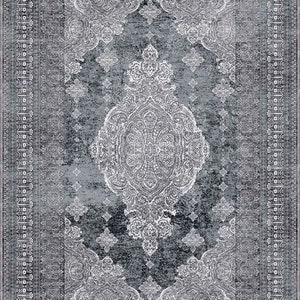May include: A grey and white patterned rug with a traditional design. The rug features a central medallion with intricate details and a border with repeating motifs.